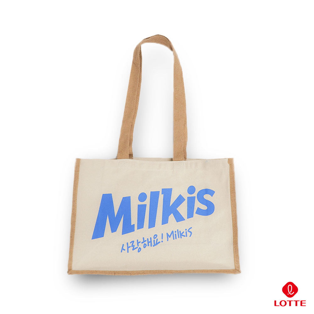 Beige Milkis tote bag with blue logo and long handles on a white background