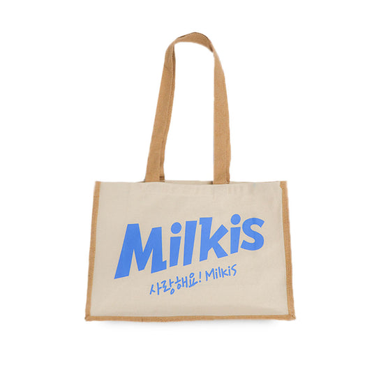 Beige Milkis tote bag with blue logo and long handles on a white background